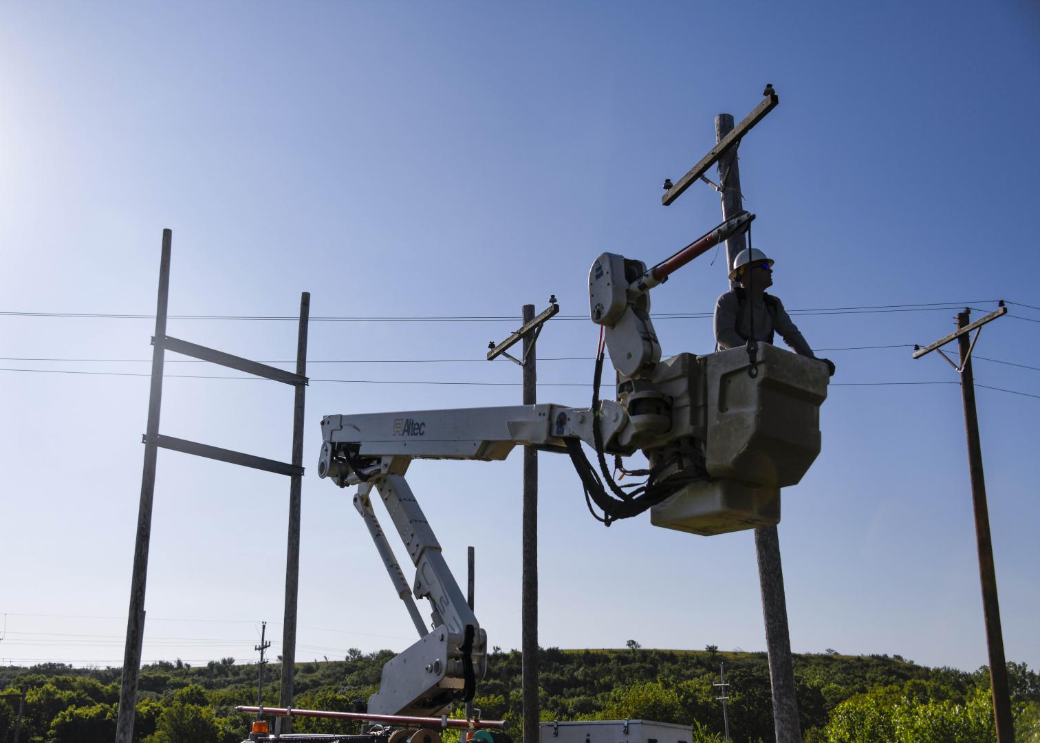 Bluestem linemen working in a bucket truck.