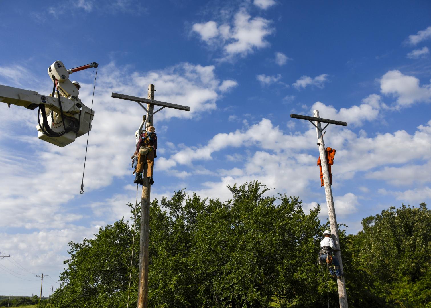 Three Bluestem linemen work together to learn about pole top rescue
