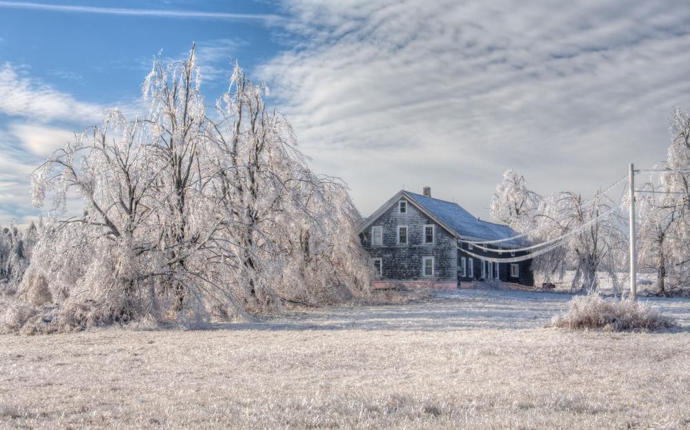 Farmhouse covered in ice
